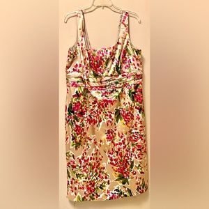 Beautiful dress,fitted,sleeveless,feminine floral design,size 16.Used only once.